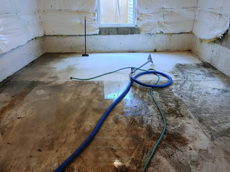 Restoration crew drying a flooded Milwaukee basement with air movers